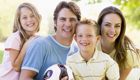 smiling family outdoors